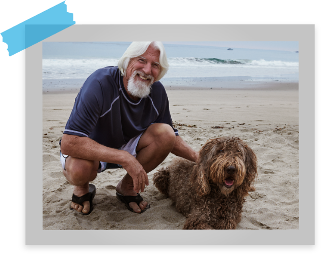 Man enjoying the beach with his dog