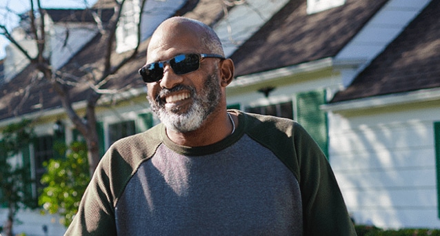 Smiling man with sunglasses A man with warm smile wearing sunglasses